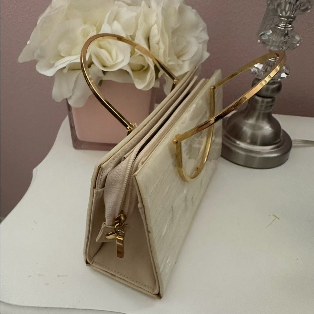 Elegant Cream Handbag with Gold Accents
